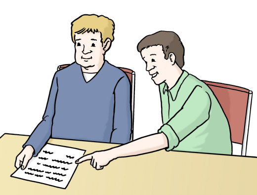 Zwei Männer sitzen an einem Tisch. Vor einem der Männer liegt ein weißes Blatt Papier mit Text. Der andere Mann zeigt auf den Text.